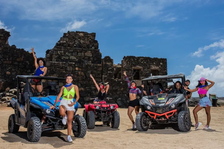 a group of people sitting on a motorcycle